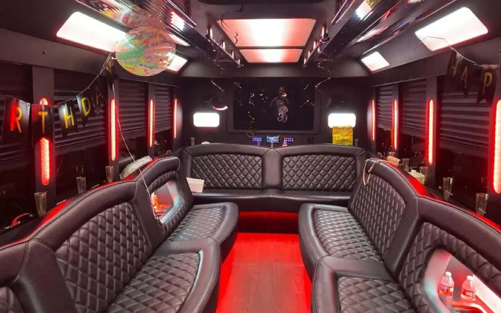 20-Passenger Party Bus interior with wraparound leather seating and LED floor - Meridian Fleet Chicago